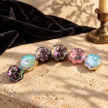 Load image into Gallery viewer, Aura pumpkins arranged on cream stone in a warm collector’s-study setting