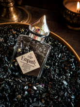 Load image into Gallery viewer, Empath crystal infused perfume oil with black tourmaline in a Halloween collector's study