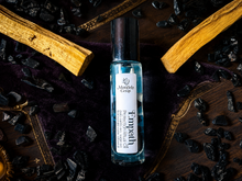 Load image into Gallery viewer, Empath protection ritual oil roll-on in a Halloween collector's study