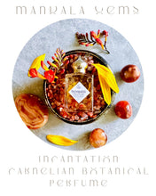 Load image into Gallery viewer, Perfume bottle with botanical elements on a textured surface, featuring the brand 'Mandala Gems'.