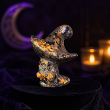 Load image into Gallery viewer, UV-reactive Yooperlite ghost witch hat carving glowing orange in a spooky Halloween scene
