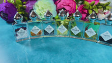Load and play video in Gallery viewer, Crystal Infused Natural Perfume Oil 7 Scents Gift Set
