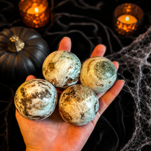 Load image into Gallery viewer, Vesuvianite and Garnet Spheres in a Halloween setting
