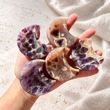 Load image into Gallery viewer, Five chevron amethyst crescent moon bowls held in hand on a white and silver holiday background
