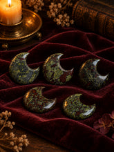Load image into Gallery viewer, Dragon's Blood Jasper crescent moon carvings on burgundy velvet
