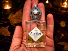 Load image into Gallery viewer, Manifest perfume oil with peridot in a Halloween collector's study
