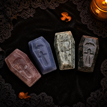Load image into Gallery viewer, Assorted mixed crystal coffin carvings in a spooky Halloween flat lay
