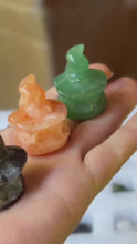 Load and play video in Gallery viewer, Video showing three miniature 3 cm mixed crystal pumpkins wearing witch hats from several angles
