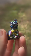 Load and play video in Gallery viewer, Single rainbow aura cat carving shown in hand, with the background softened
