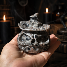 Load image into Gallery viewer, Yooperlite pumpkin with witch hat resting in an open hand for size reference
