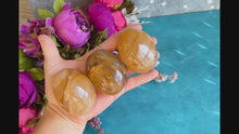 Load and play video in Gallery viewer, Golden Healer Palm Stones (also known as Yellow Hematoid Quartz)
