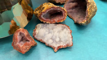Load and play video in Gallery viewer, Pink and Red Raw Chalcedony Geodes
